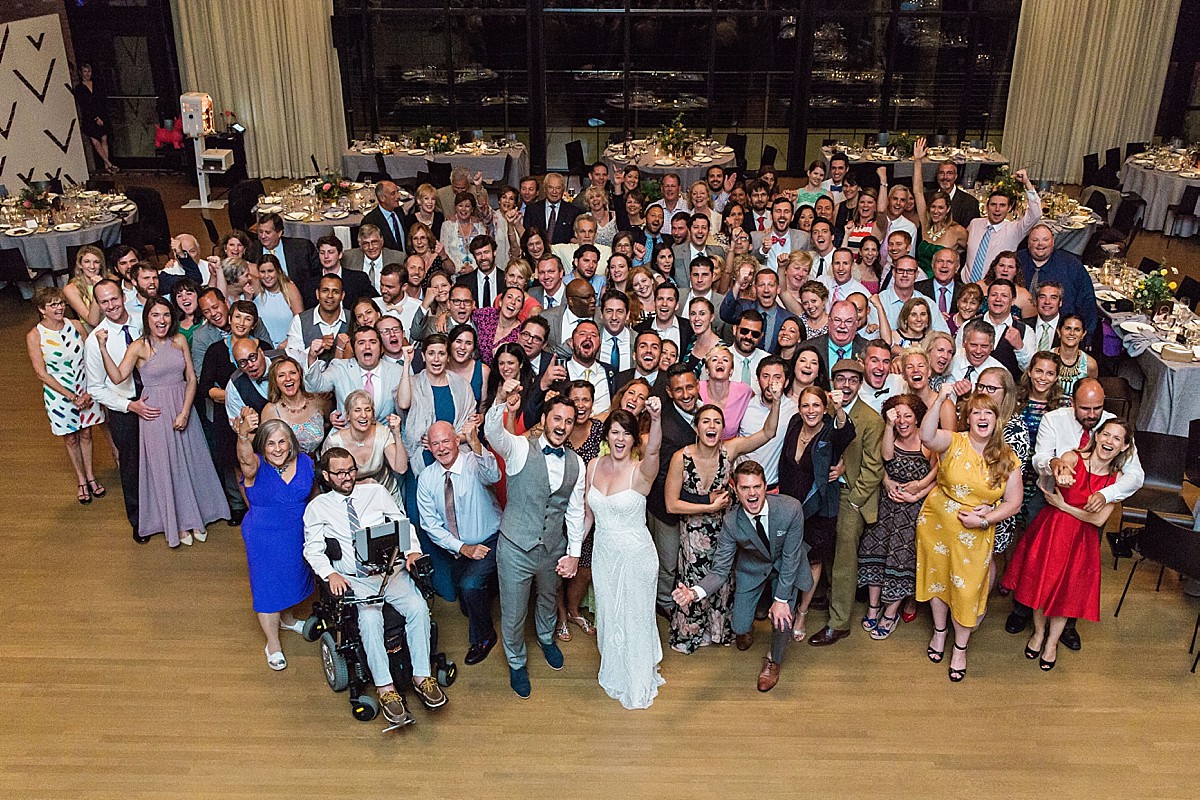 Group shot at the Roundhouse, Beacon NY wedding reception, by Clean Plate Pictures, photojournalist Hudson Valley wedding photographer.