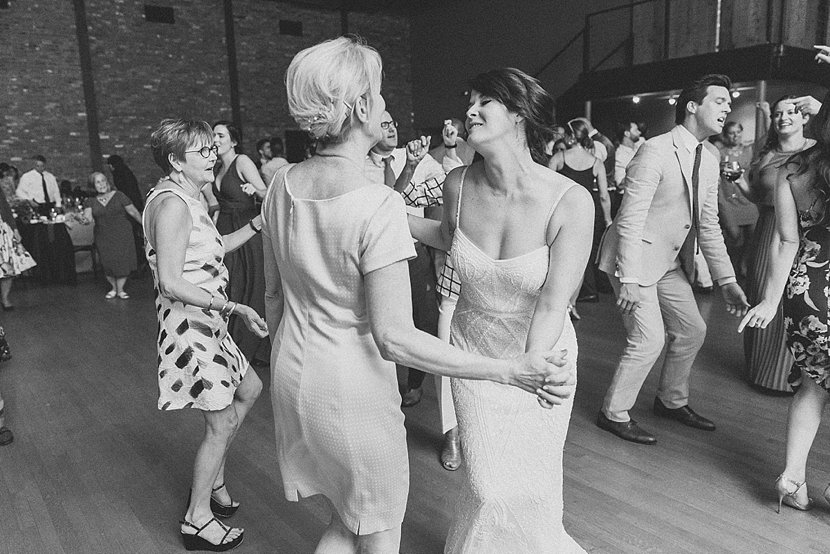 Candid wedding reception dancing photos at a Roundhouse, Beacon NY wedding by Clean Plate Pictures, Hudson Valley wedding photographer.