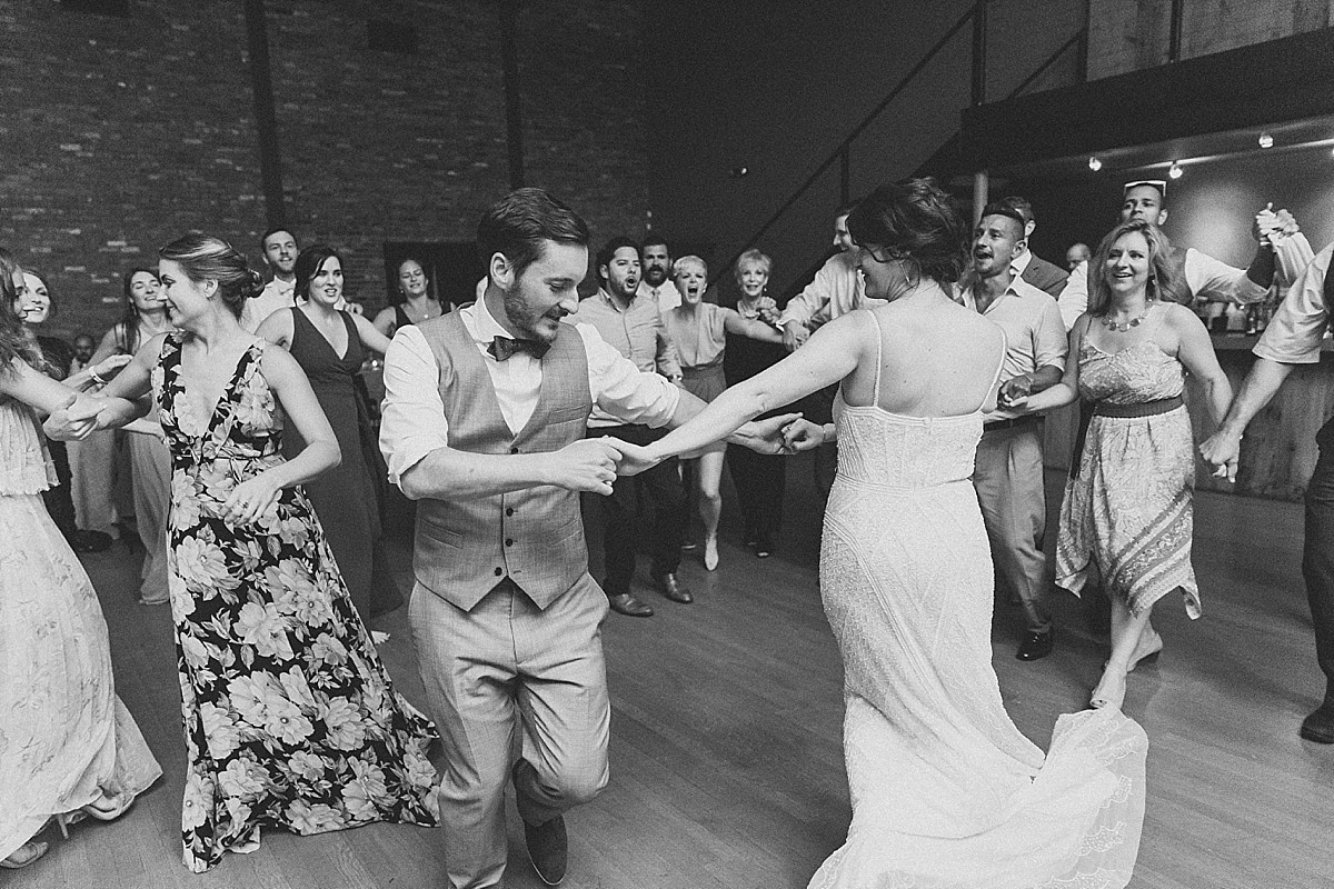 Candid wedding reception dancing photos at a Roundhouse, Beacon NY wedding by Clean Plate Pictures, Hudson Valley wedding photographer.